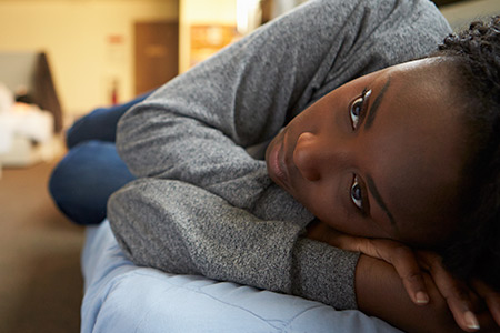 A young girl sleeps in a shelter